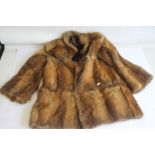 A VINTAGE LADIES' FUR COAT