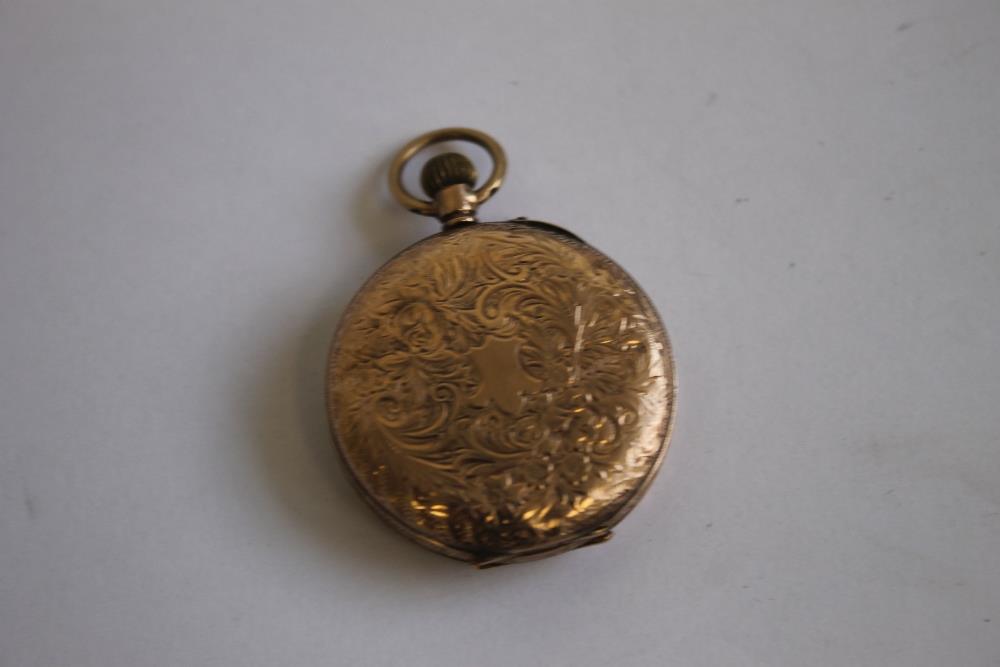 A 9ct GOLD LADIES' FOB WATCH, with gilt foliate dial, with black Roman Numeral markings. - Image 2 of 2