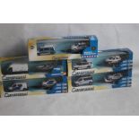 FIVE CARARAMA BOXED POLICE VEHICLES WITH TRAILERS (5)