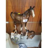 A BESWICK SWISH TAIL HORSE, TOGETHER WITH A FOAL AND TWO HOUNDS