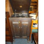 AN OAK CASED HMV GRAMOPHONE