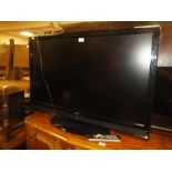 A TECHNIKA 42" FLATSCREEN TV - WITH A SPARE REMOTE