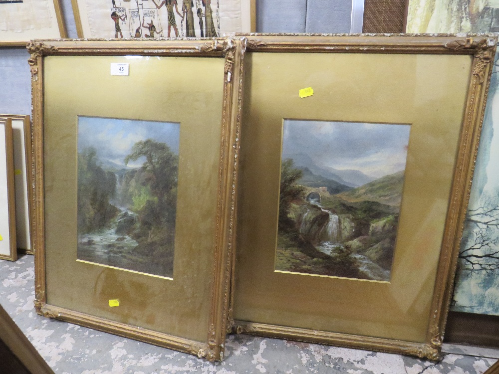 A PAIR OF ANTIQUE GILT FRAMED WATERCOLOURS DEPICTING COUNTRY WATERFALLS