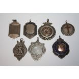 SEVEN HALLMARKED SILVER FOB MEDALLIONS