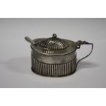 A HALLMARKED SILVER MUSTARD POT AND LINER