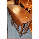 AN OAK BARLEY TWIST TABLE TOGETHER WITH OAK COMMODE