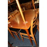 A RETRO TEAK EXTENDING DINING TABLE WITH FOUR CHAIRS