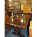 AN OAK REFECTORY STYLE TABLE WITH FOUR HOOP BACK CHAIRS