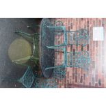 A PAINTED GREEN METAL GARDEN TABLE AND 5 CHAIRS
