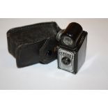 A VINTAGE CORONET MIDGET CAMERA IN LEATHER CASE