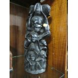 AN TRIBAL STYLE EBONISED CARVING