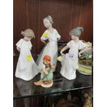 THREE FEMALE NAO FIGURINES, TOGETHER WITH A GOEBEL FIGURE (4)