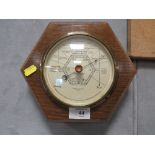 AN OAK FRAMED HEXAGONAL SHAPED WALL BAROMETER BY ROBERT LOVE & SON GREENOCK