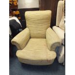 A VINTAGE HOWARDS STYLE UPHOLSTERED ARMCHAIR