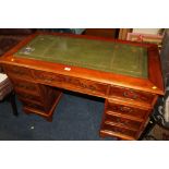 A REPRODUCTION YEW WOOD PEDESTAL DESK WITH GREEN LEATHER INSERT TOP W- 122 CM