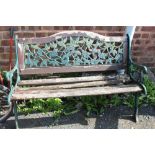 A GARDEN BENCH A/F WITH CAST LEGS AND BACK PLATE