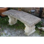 A RECONSTITUTED STONE GARDEN PEDESTAL BENCH