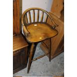 AN OAK BAR STOOL WITH SWIVEL SEAT