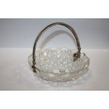 AN ANTIQUE CUT GLASS BOWL WITH DUTCH SILVER MOUNTS