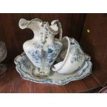 AN ANTIQUE FLORAL FIVE PIECE JUG AND BOWL SET STAMPED OUKE TO BASE