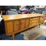 A RETRO TEAK SIDEBOARD WITH THREE DRAWERS & TWO CUPBOARDS W 197 CM