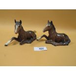TWO BESWICK SEATED FOAL FIGURES