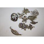 A BOX OF VINTAGE MARCASITE BROOCHES