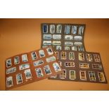 THREE VINTAGE ALBUMS OF CIGARETTE CARDS TO INCLUDE WAR RELATED EXAMPLES