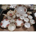 A TRAY OF ROYAL ALBERT OLD COUNTRY ROSES CHINA TO INCLUDE A TEAPOT AND TRIOS