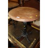 A CAST IRON BASE PUB TABLE