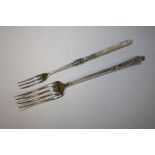 A GEORGE UNITE SILVER PICKLE FORK WITH MOTHER OF PEARL HANDLE TOGETHER WITH A CONTINENTAL FORK