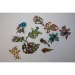 A QUANTITY OF FLORAL ENAMEL BROOCHES