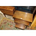 A NEST OF THREE TABLES TOGETHER WITH A STRIPED SUTHERLAND TABLE