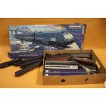 A QUANTITY OF HORNBY RAILWAY AND OTHER MODEL RAIL CARRIAGES ETC