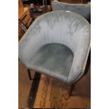 A MODERN UPHOLSTERED TUB CHAIR