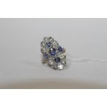 A SAPPHIRE AND DIAMOND RING, set with ten brilliant cut diamonds and five sapphires, hallmarks