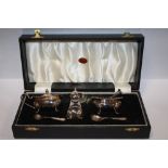 A CASED HALLMARKED SILVER CRUET SET