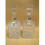 A PAIR OF CUT GLASS DECANTERS WITH 925 STERLING SILVER COLLARS