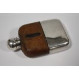 A SILVER PLATED AND GLASS HIP FLASK