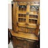A MELLOWCRAFT QUALITY OAK CARVED AND GLAZED DISPLAY BOOKCASE H-194 CM W-135 CM