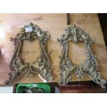 A PAIR OF VINTAGE BRASS PIERCED ANGELIC SHAPED PICTURE FRAMES