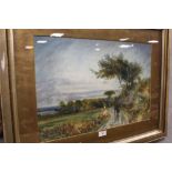 A LARGE GILT FRAMED WATERCOLOUR DEPICTING FIGURES ON A COUNTRY PATH INITIALLED R.B.E. LOWER LEFT
