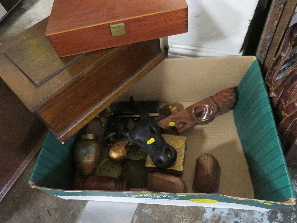 A TRAY OF TREEN AND BRASSWARE TO INCLUDE WOODEN LIDDED BOXES, CARVED WOODEN MASKS ETC.