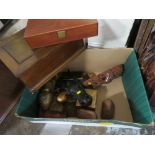 A TRAY OF TREEN AND BRASSWARE TO INCLUDE WOODEN LIDDED BOXES, CARVED WOODEN MASKS ETC.