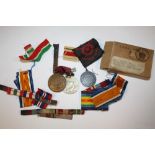 A COLLECTION OF MEDALS TO INCLUDE A ROYAL LIFE SAVING SOCIETY EXAMPLE, GOOD SAMARITAN MEDAL, RIBBONS