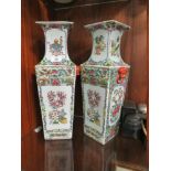 A PAIR OF ORIENTAL CERAMIC TWIN HANDLED FAMILLE ROSE VASES WITH FOUR CHARACTER BACK STAMP, H 45 CM