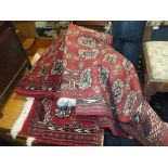 THREE ASSORTED 20TH CENTURY RED RUGS