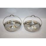 A PAIR OF WMF CIRCULAR SILVER PLATED BASKETS, with openwork and Greek key design border, basket