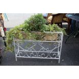 A WROUGHT IRON VINTAGE PLANTER ON STAND PLUS CONTENTS