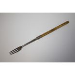 AN ANTIQUE HALLMARKED SILVER PICKLE FORK